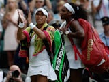 Britain's Heather Watson (L) applauds the crowd as she leaves the court withUS players Serena Williams following their women's singles third round match on day five of the 2015 Wimbledon Championships at The All England Tennis Club in Wimbledon, southwest