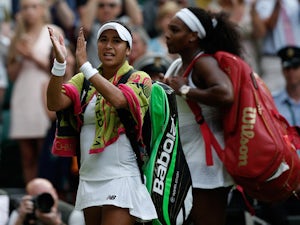 Britain's Heather Watson (L) applauds the crowd as she leaves the court withUS players Serena Williams following their women's singles third round match on day five of the 2015 Wimbledon Championships at The All England Tennis Club in Wimbledon, southwest
