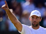 Croatia's Ivo Karlovic celebrates beating France's Jo-Wilfried Tsonga during their men's singles third round match on day six of the 2015 Wimbledon Championships at The All England Tennis Club in Wimbledon, southwest London, on July 4, 2015