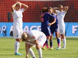 Mizuho Sakaguchi and Rumi Utsugi of Japan celebrate after the FIFA Women's World Cup Semi Final match between Japan and England at the Commonwealth Stadium on July 1, 2015