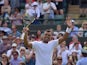 France's Jo-Wilfried Tsonga celebrates beating Spain's Albert Ramos-Vinolas during their men's singles second round match on day four of the 2015 Wimbledon Championships at The All England Tennis Club in Wimbledon, southwest London, on July 2, 2015