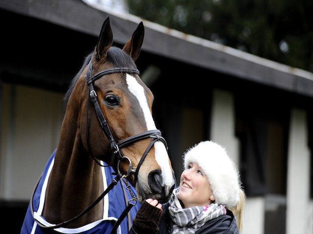 Three day eventer Laura Collett with ex racehorse Kauto Star at Kempton Park racecourse on December 26, 2013 
