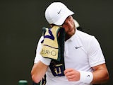 Liam Broady of Great Britain towels down between games in his Gentlemens Singles Second Round match against David Goffin of Belgium during day three of the Wimbledon Lawn Tennis Championships at the All England Lawn Tennis and Croquet Club on July 1, 2015