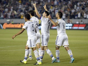 Robbie Keane #7 of Los Angeles Galaxy celebrates his hat-trick with teammates after scoring his third goal of the game against Toronto FC on July 4, 2015