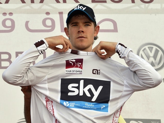 Britain's Luke Rowe is seen on the podium as he gets the pearl white jersey of best young rider after the stage three individual time-trial of the 2015 Tour of Qatar on February 10, 2015