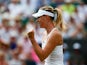 Maria Sharapova of Russia celebrates match point in her Ladies Singles Second Round match against Robin Haase of Netherlands during day three of the Wimbledon Lawn Tennis Championships at the All England Lawn Tennis and Croquet Club on July 1, 2015
