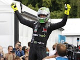 Nextev TCRs Brazilian driver Nelson Piquet JR celebrates at the end of the race after winning the inaugural World Championship title after the 2015 FIA Formula E London ePrix championship at Battersea Park in London, England, on June 28, 2015