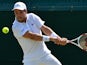 Spain's Roberto Bautista Agut returns against Georgia's Nikoloz Basilashvili during their men's singles third round match on day six of the 2015 Wimbledon Championships at The All England Tennis Club in Wimbledon, southwest London, on July 4, 2015