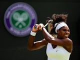 Serena Williams of the United States hits a backhand in her Ladiess Singles first round match against Margarita Gasparyan of Russia during day one of the Wimbledon Lawn Tennis Championships at the All England Lawn Tennis and Croquet Club on June 29, 
