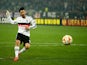 Tolgay Arslan of Besiktas scores his penalty in the shoot out during the 2nd leg of the UEFA Europa League Round of 32 match between Besiktas and Liverpool at the Ataturk Olympic Stadium on February 26, 2015