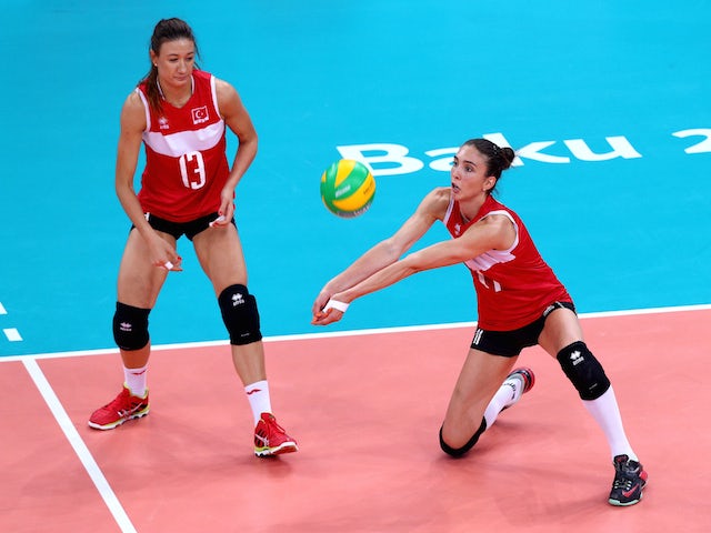 Neriman Ozsoy (13) and Naz Aydemir Akyol (11) of Turkey in action during the Women's Volleyball gold medal match between Turkey and Poland on day fifteen of the Baku 2015 European Games at the Crystal Hallon June 27, 2015