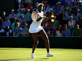 Venus Williams of the United States plays a forehand in her Ladies Singles first round match against Madison Brengle of the United States during day one of the Wimbledon Lawn Tennis Championships at the All England Lawn Tennis and Croquet Club on June 29,
