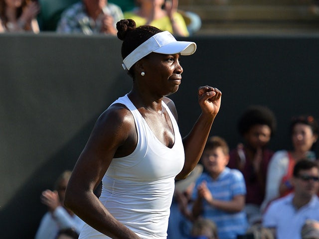 US player Venus Williams celebrates beating Serbia's Aleksandra Krunic during their women's singles third round match on day five of the 2015 Wimbledon Championships at The All England Tennis Club in Wimbledon, southwest London, on July 3, 2015