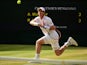 Andy Murray of Great Britain plays a forehand during the Gentlemens Singles Semi Final match against Roger Federer of Switzerland during day eleven of the Wimbledon Lawn Tennis Championships at the All England Lawn Tennis and Croquet Club on July 10, 2015
