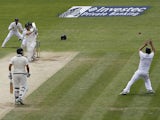 England's captain Alastair Cook makes a stunning catch to take the wicket of Australia's Brad Haddin during play on the fourth day of the opening Ashes cricket test match between England and Australia at The Swalec Stadium in Cardiff, south Wales, on July