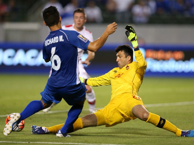Kryiakos Stamatopolous #22 of Canada kicks the ball away from Ricahrd Menjivar #6 of El Salvador in their CONCACAF Gold Cup Group B match at StubHub Center on July 8, 2015