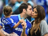 Cesc Fabregas of Chelsea kisses his girl friend Daniella Semaan after the Barclays Premier League match between Chelsea and Sunderland at Stamford Bridge on May 24, 2015