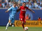 Daniel Lovitz #19 of Toronto FC and Patrick Mullins #14 of New York City FC battle for the ball during a soccer game at Yankee Stadium on July 12, 2015