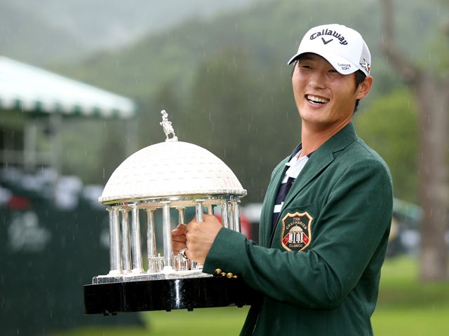 Danny Lee of New Zealand poses with the trophy after winning on the second hole of a sudden death playoff at the Greenbrier Classic held at The Old White TPC on July 5, 2015