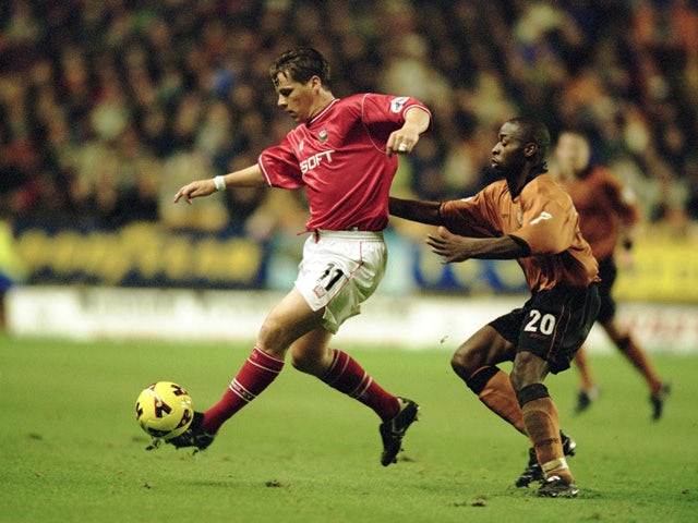 Darren Barnard of Barnsley reaches the ball ahead of Shaun Newton of Wolverhampton Wanderers during the Nationwide League Division One match played at Molineux on November 27, 2001