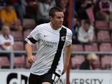 Eddie Nolan of Scunthorpe United in action during the Sky Bet League Two match between Northampton Town and Scunthorpe United at Sixfields Stadium on September 7, 2013