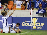 Dustin Corea, of El Salvador bottom, is mobbed by his teammates after scoring in the second half against Costa Rica at BBVA Compass Stadium on July 11, 2015