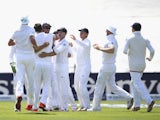England players celebrate after David Warner is dismissed on day two of the First Test of The Ashes on July 9, 2015