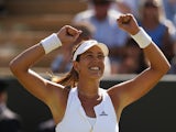 Garbine Muguruza of Spain celebrates victory in her Ladies' Singles Fourth Round match against Caroline Wozniacki of Denmark during day seven of the Wimbledon Lawn Tennis Championships at the All England Lawn Tennis and Croquet Club on July 6, 2015