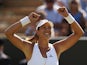 Garbine Muguruza of Spain celebrates victory in her Ladies' Singles Fourth Round match against Caroline Wozniacki of Denmark during day seven of the Wimbledon Lawn Tennis Championships at the All England Lawn Tennis and Croquet Club on July 6, 2015