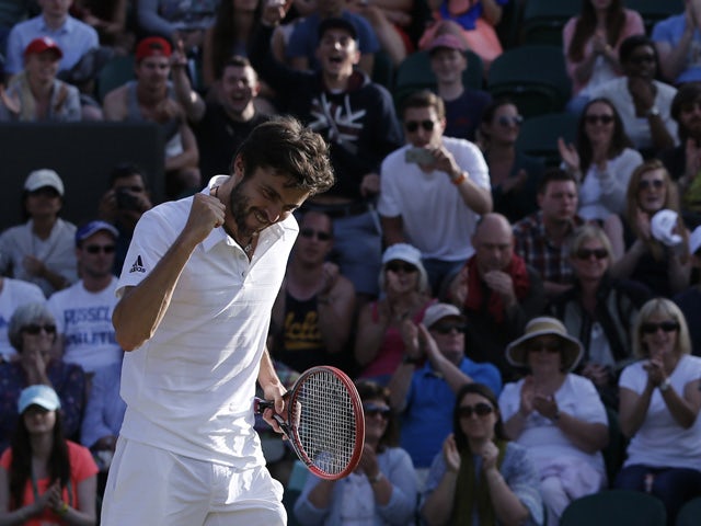 France's Gilles Simon celebrates beating Czech Republic's Tomas Berdych during their men's singles fourth round match on day seven of the 2015 Wimbledon Championships at The All England Tennis Club in Wimbledon, southwest London, on July 6, 2015