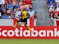 Rudolph Austin #17 of Jamaica celebrates his goal in stoppage time against the Canada at BBVA Compass Stadium on July 11, 2015 