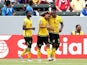 Jermaine Taylor #22 of Jamaica celebrates with Westley Morgan #4 and Kemar Lawrence #20 after his first half goal against Costa Rica in their CONCACAF Gold Cup Group B match at StubHub Center on July 8, 2015
