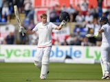 England batsman Joe Root celebrates after reaching his century during day one of the 1st Investec Ashes Test match between England and Australia at SWALEC Stadium on July 8, 2015