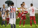 Marco Djuricin of Red Bull is congratulated by team mate Christoph Leitgeb after scoring a goal during the friendly match between Red Bull Salzburg and West Brom on July 8, 2015