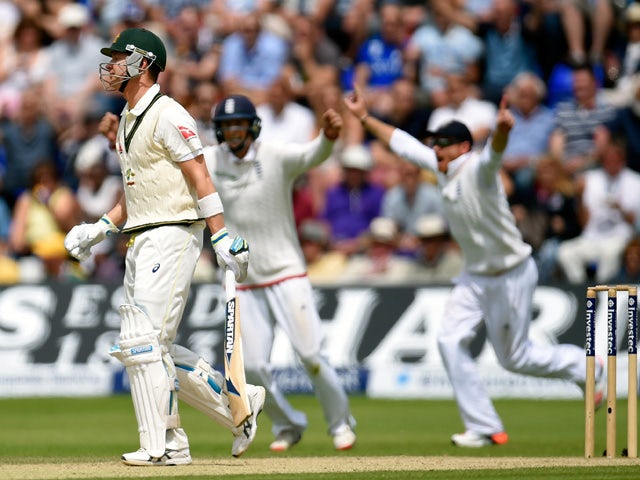The England slips celebrate as Australia captain Michael Clarke reacts after being caught during day four of the 1st Investec Ashes Test match between England and Australia at SWALEC Stadium on July 11, 2015