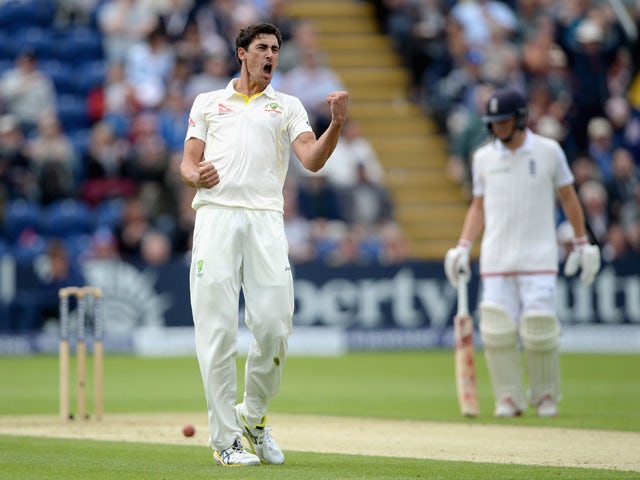 Mitchell Starc of Australia celebrates dismissing Ian Bell of England during day one of the 1st Investec Ashes Test match between England and Australia at SWALEC Stadium on July 8, 2015