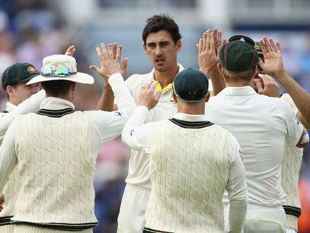 Australia's Mitchell Starc celebrates dismissing Moeen Ali on day two of the First Test of The Ashes on July 9, 2015