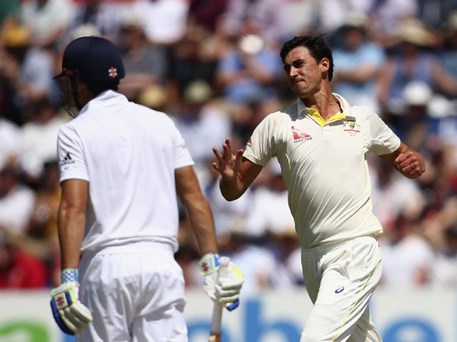 Mitchell Starc of Australia celebrates after taking the wicket of Alastair Cook of England during day three of the 1st Investec Ashes Test match between England and Australia at SWALEC Stadium on July 10, 2015