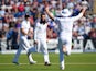 England bowler Moeen Ali celebrates with Alastair Cook and Ben Stokes after dismissing Michael Clarke during day two of the 1st Investec Ashes Test match between England and Australia at SWALEC Stadium on July 9, 2015
