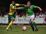 Josh Murphy of Norwich City battles with Aaron Taylor of Gorleston during the pre season friendly match between Gorleston and Norwich City at Gorleston football and social club on July 11, 2015