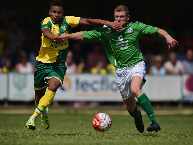 Josh Murphy of Norwich City battles with Aaron Taylor of Gorleston during the pre season friendly match between Gorleston and Norwich City at Gorleston football and social club on July 11, 2015