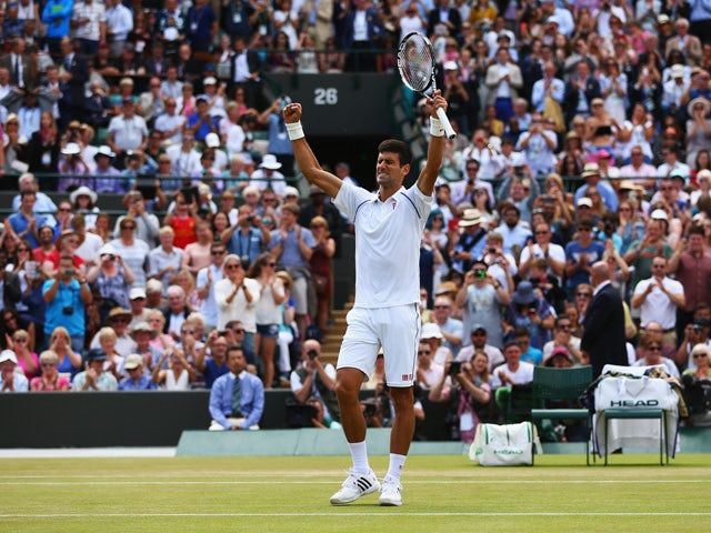 Novak Djokovic of Serbia celebrates after winning his Gentlemens Singles Fourth Round match against Kevin Anderson of South Africa during day eight of the Wimbledon Lawn Tennis Championships at the All England Lawn Tennis and Croquet Club on July 7, 2015