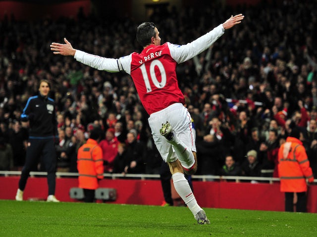 Arsenal's Dutch striker Robin Van Persie celebrates scoring his goal during the English Premier League football match between Arsenal and Everton at The Emirates Stadium in north London, England on December 10, 2011