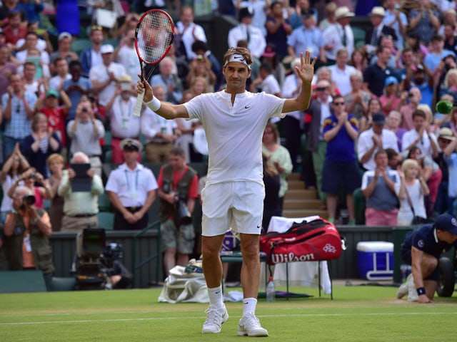 Switzerland's Roger Federer reacts after beating Spain's Roberto Bautista Agut during their men's singles fourth round match on day seven of the 2015 Wimbledon Championships at The All England Tennis Club in Wimbledon, southwest London, on July 6, 2015