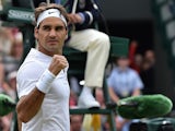 Switzerland's Roger Federer reacts after beating France's Gilles Simon during their men's quarter-finals match on day nine of the 2015 Wimbledon Championships at The All England Tennis Club in Wimbledon, southwest London, on July 8, 2015