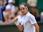 Switzerland's Roger Federer reacts after winning the second set against Serbia's Novak Djokovic during their men's singles final match on Centre Court on day thirteen of the 2015 Wimbledon Championships at The All England Tennis Club in Wimbledon, southwe