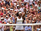 US player Serena Williams reacts after beating her sister US player Venus Williams during their women's singles fourth round match on day seven of the 2015 Wimbledon Championships at The All England Tennis Club in Wimbledon, southwest London, on July 6, 2