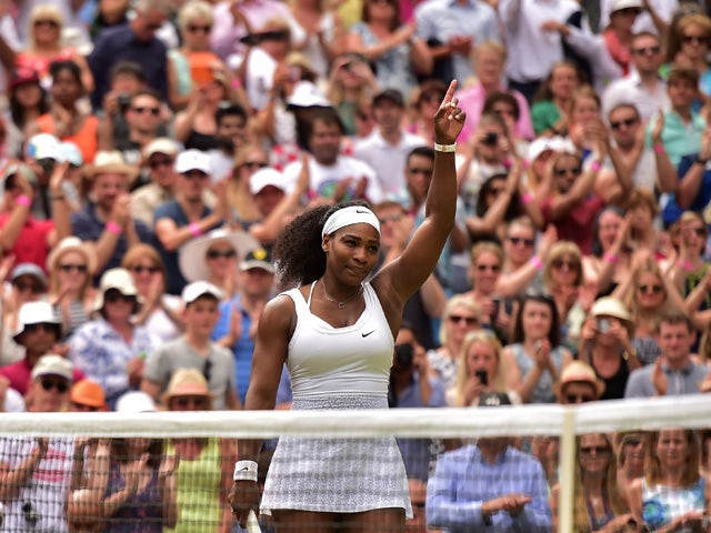 US player Serena Williams reacts after beating her sister US player Venus Williams during their women's singles fourth round match on day seven of the 2015 Wimbledon Championships at The All England Tennis Club in Wimbledon, southwest London, on July 6, 2