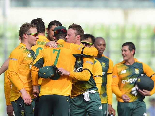 South Africa cricketers celebrate after winning the second T20 cricket match between Bangladesh and South Africa at the Sher-e-Bangla National Cricket Stadium in Dhaka on July 7, 2015