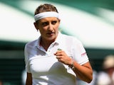 Timea Bacsinszky of Switzerland celebrates a point in her Ladies' Singles Fourth Round match against Monica Niculescu of Romania during day seven of the Wimbledon Lawn Tennis Championships at the All England Lawn Tennis and Croquet Club on July 6, 2015